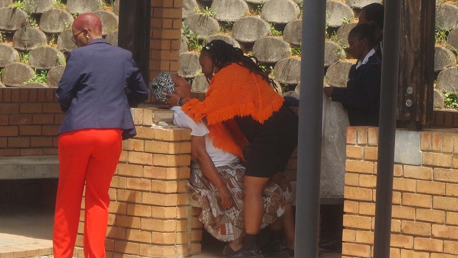 Mother collapses after son charged with rapes 